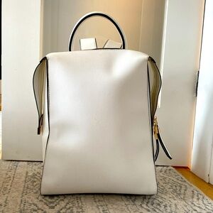 Faux leather white backpack. Used but good condition. Smoke free home.